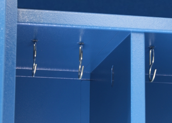 The cabinet is equipped with a shelf and hooks for hanging clothes.